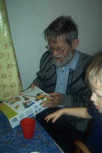 Grandpa Viggo helps with the birthday gifts