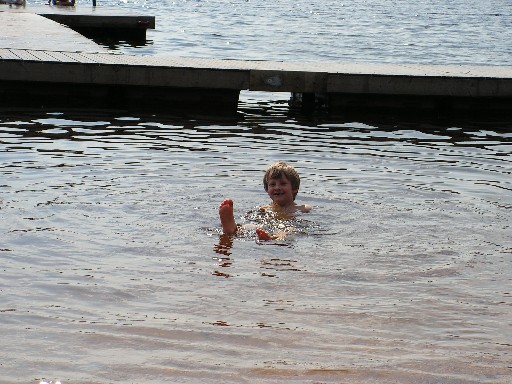 Joshua loves to swim in Swedish lakes